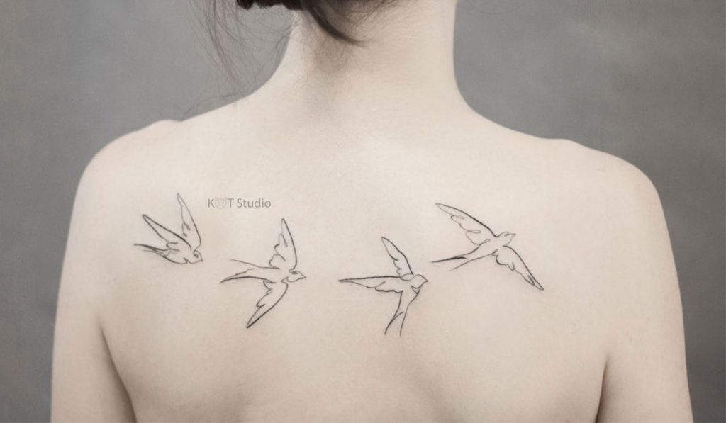 Татуировки птиц на ключице